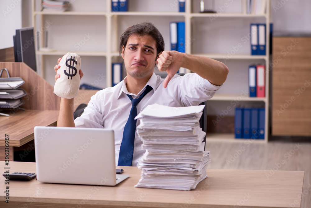 Fototapeta premium Young male employee in remuneration concept