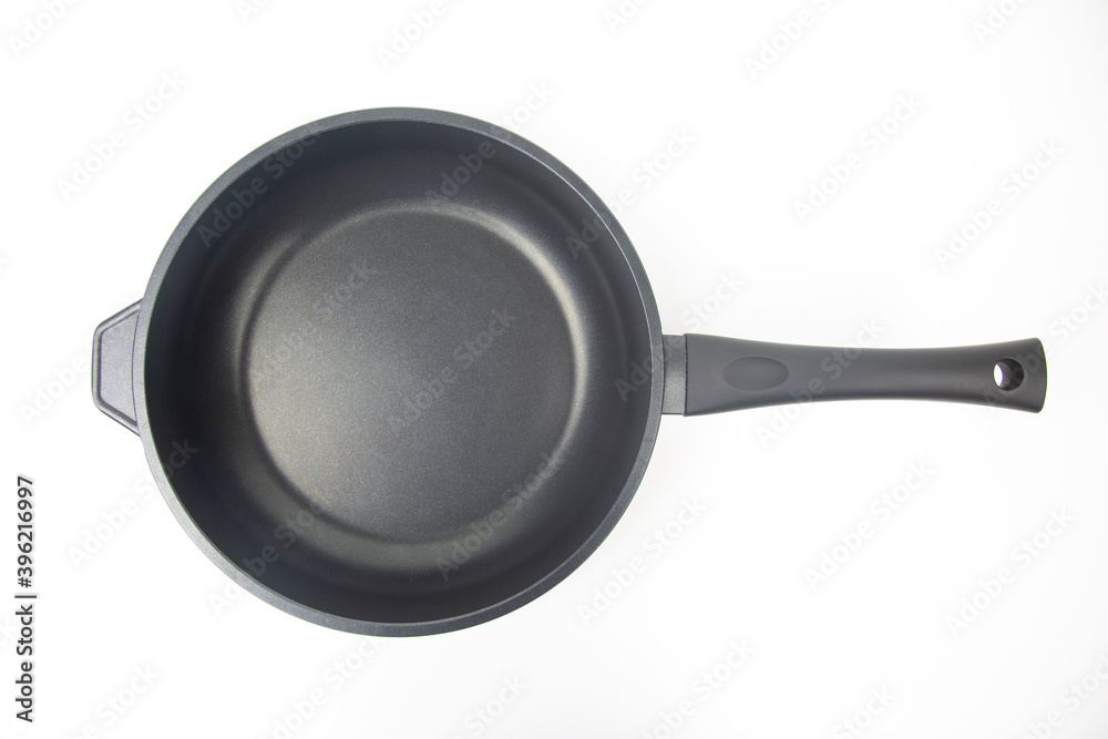 Biack frying pan with non-stick teflon coating on white background Biack frying pan with non-stick teflon coating on white background