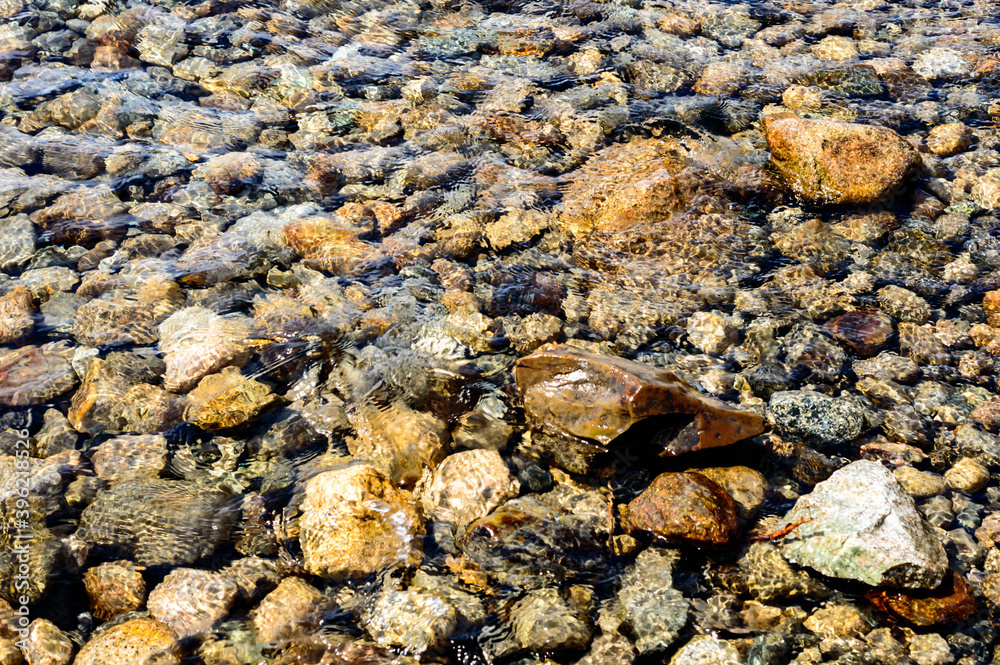 Rocks under crystal clear water in a lake Rocks under crystal clear water in a lake