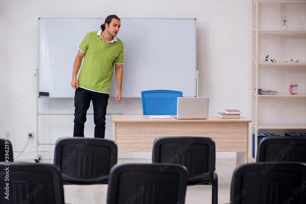Young male student in business presentation concept Young male student in business presentation concept