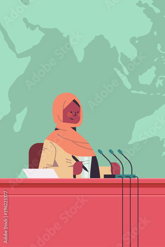 black muslim female doctor giving speech at tribune with microphone medical conference medicine healthcare concept portrait vertical vector illustration