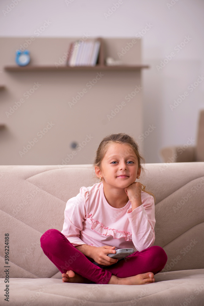 Small girl staying alone at home Small girl staying alone at home
