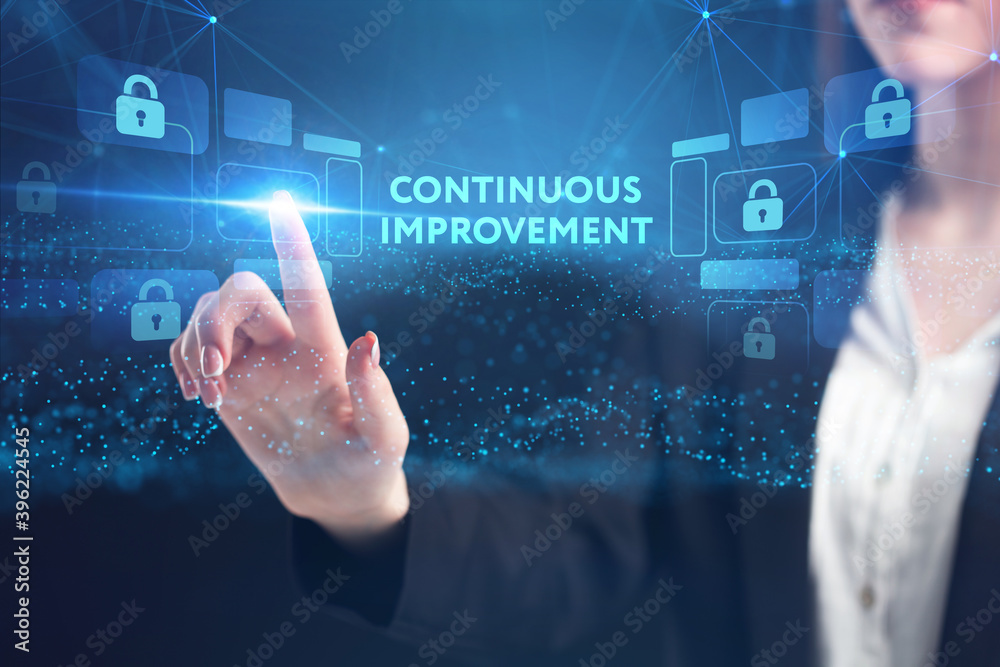 Obraz premium Business, Technology, Internet and network concept. Young businessman working on a virtual screen of the future and sees the inscription: Continuous improvement