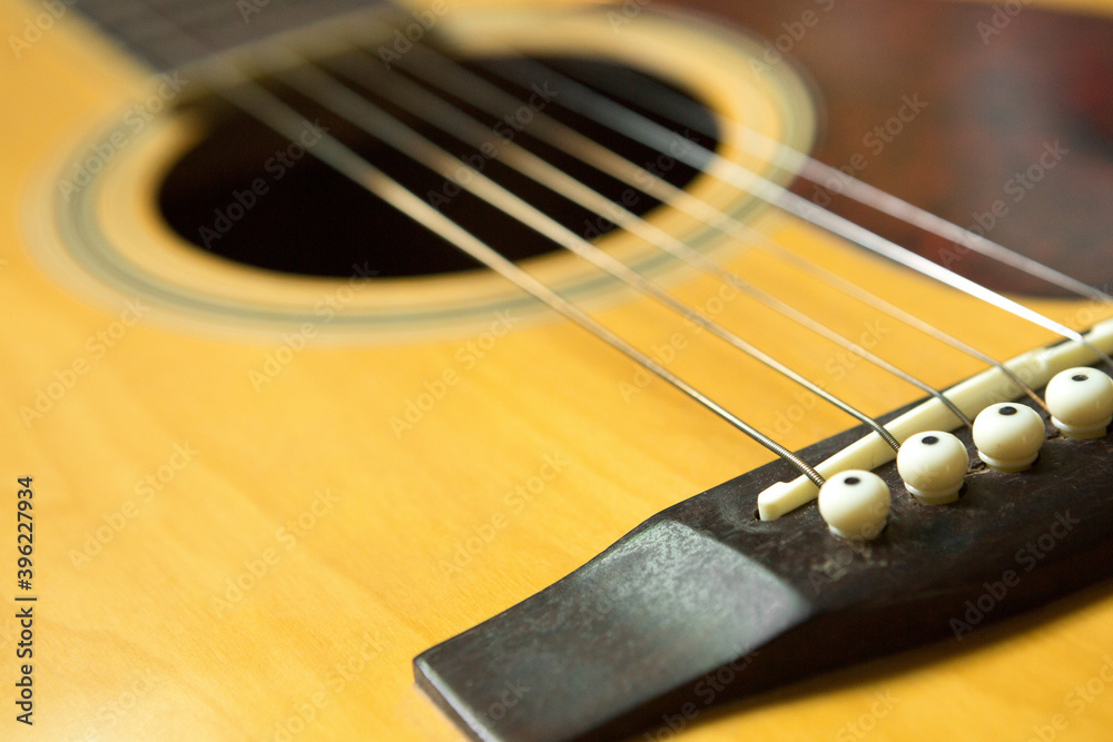 Selective focus of Bridge on Acoustic guitar  and copy space