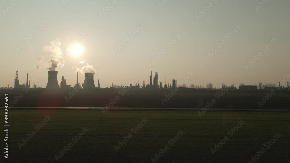Aerial view of Fume From Factory Chimneys Over sky during sunset. Industrial Pollution. Aerial view of Fume From Factory Chimneys Over sky during sunset. Industrial Pollution.
