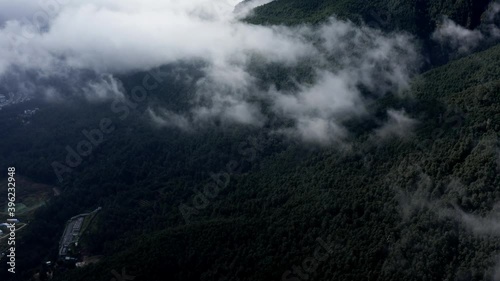 Cloudy Cangshan mountain range above Dali city, Yunnan China, high aerial view photo