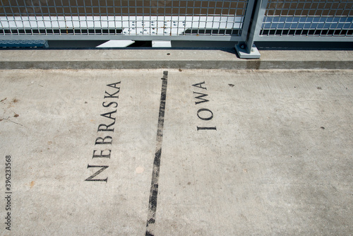  Border seperation marker between Iowa and Nebraska on the Bob Kerrey pedestrian bridge photo