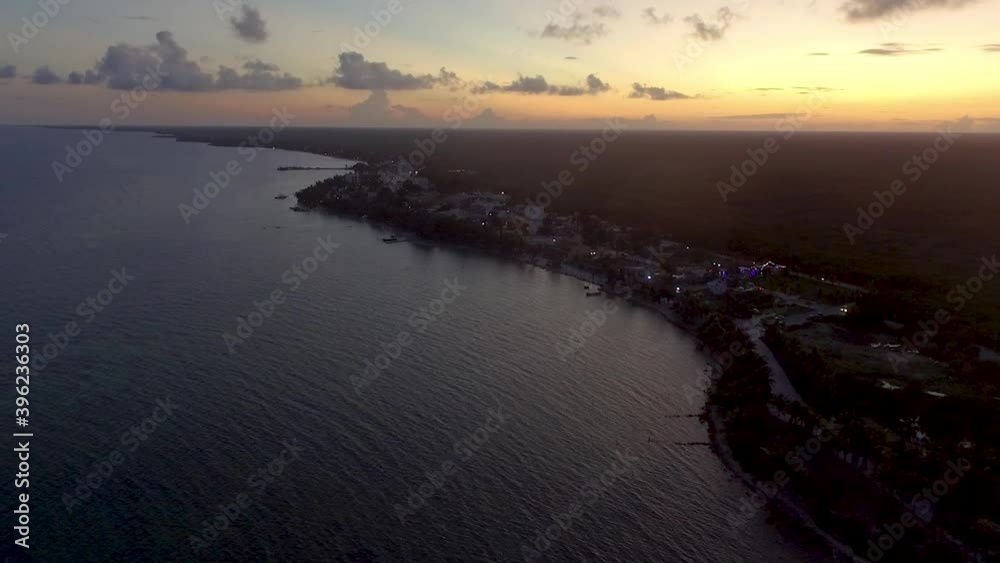 Sunset flight over a Caribbean fishing beach village Sunset flight over a Caribbean fishing beach village