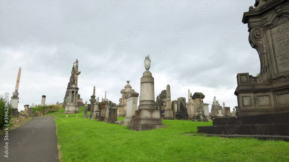 Tilt pan shot from a tombstone revealing more of the necropolis in Glasgow Scotland Tilt pan shot from a tombstone revealing more of the necropolis in Glasgow Scotland