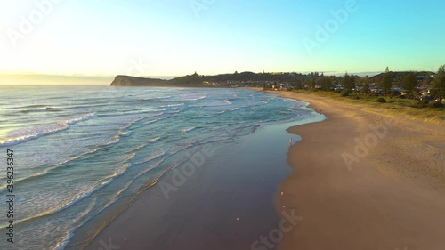 Wallpaper Mural Cinematic rising drone shot into the sun at Lennox Head Beach near Bryon Bay Torontodigital.ca