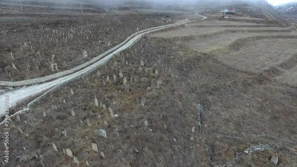 flight over the old cemetery between which the road passes and the fog over the cemetery flight over the old cemetery between which the road passes and the fog over the cemetery