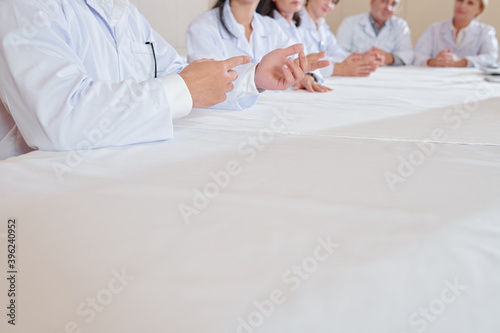 Cropped image of scientists meeting in boardroom to discuss properties of ne vaccine they are working on