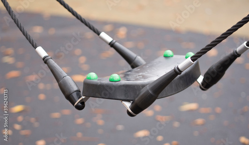 Children's swing seat on cables