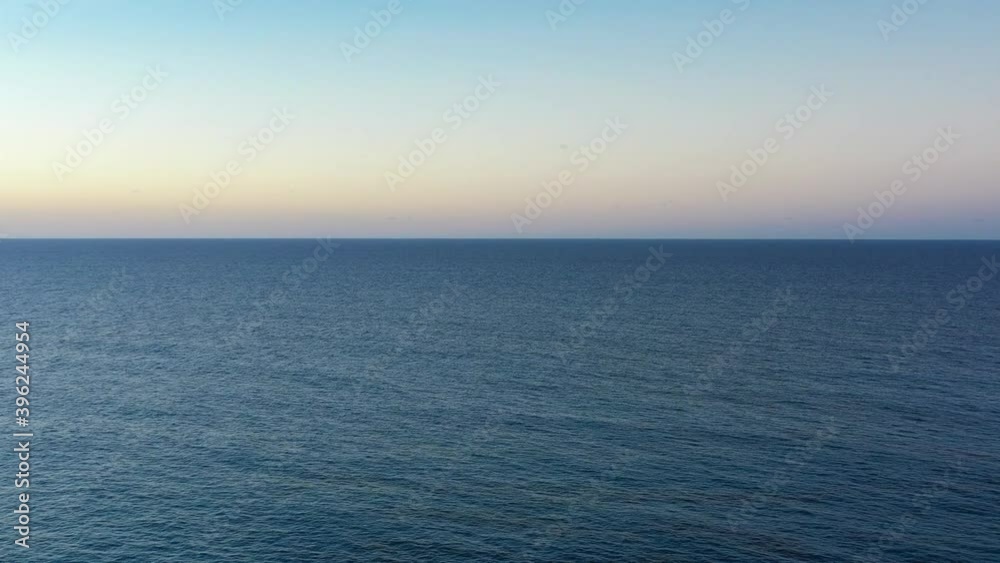 Aerial view towards the horizon during twilight. Aerial view towards the horizon during twilight.