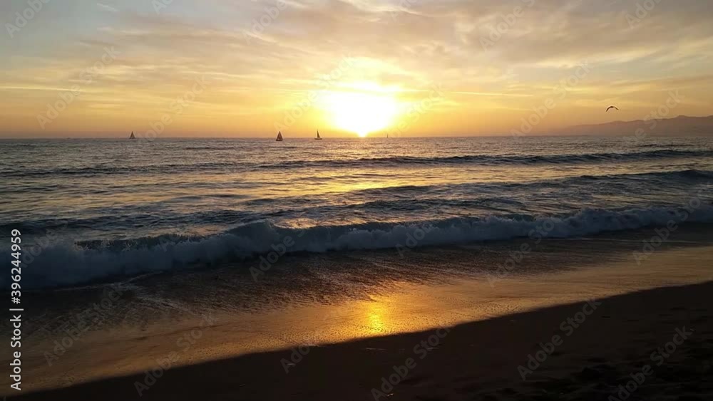 Beautiful Beach Sunset in Romantic Atmosphere under an Orange Sky Beautiful Beach Sunset in Romantic Atmosphere under an Orange Sky