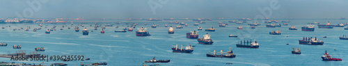 Wide panorama image of Container Ships and tankers anchored at the Singapore strait photo