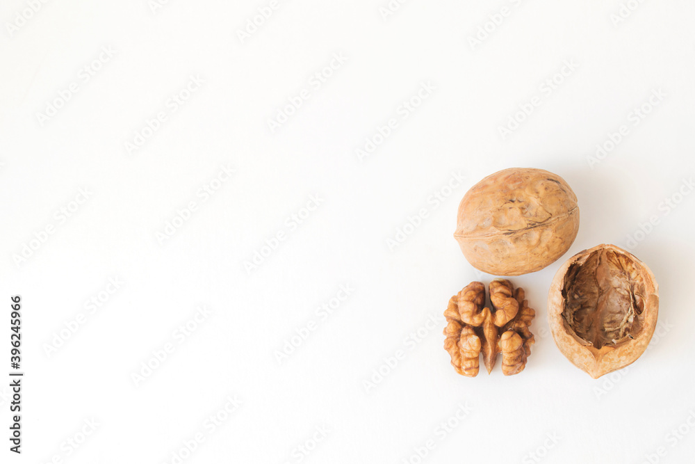 Walnuts peeled and shelled on a white background. Walnuts peeled and shelled on a white background.