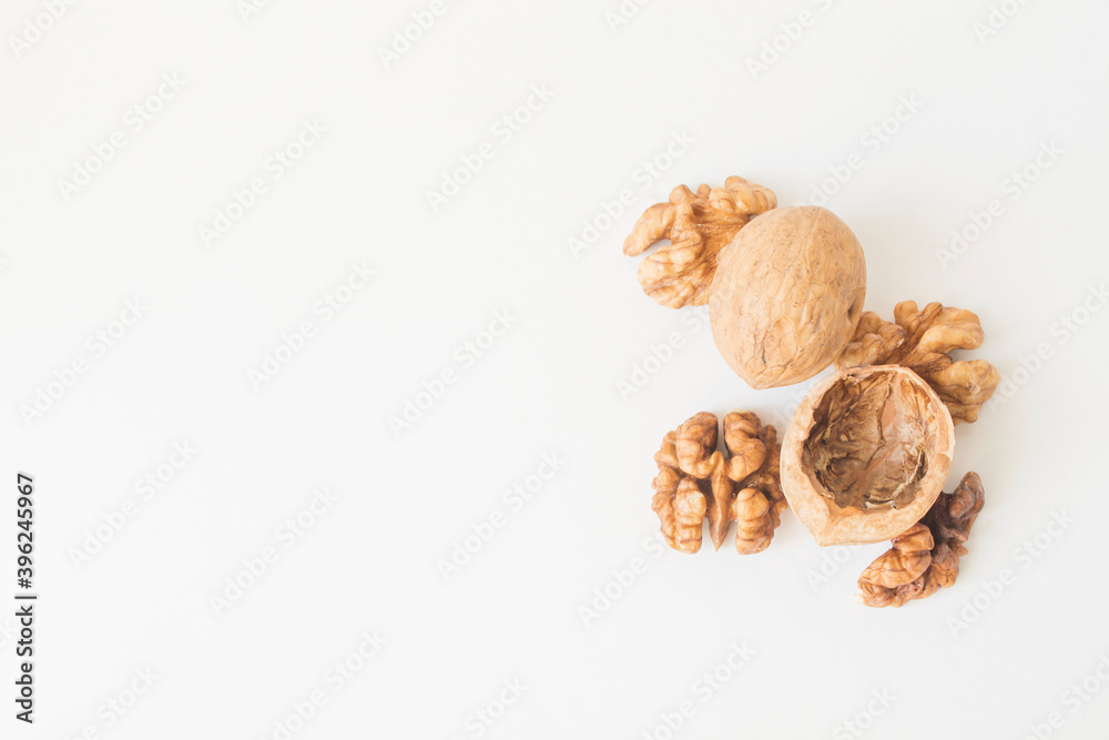 Walnuts peeled and shelled on a white background. Walnuts peeled and shelled on a white background.