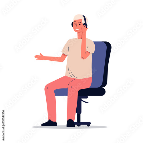 Cartoon man listening to music on headphones sitting on computer chair