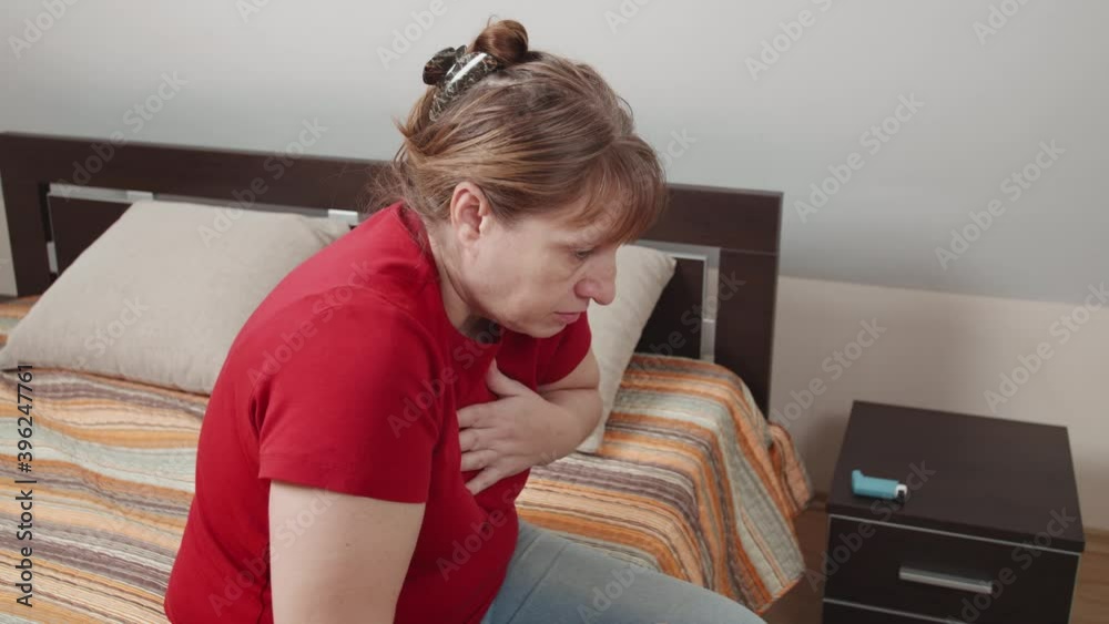 Suffer from allergy attack. A woman has a seasonal asthma attack. A stressed female use an inhaler to cure. Suffer from allergy attack. A woman has a seasonal asthma attack. A stressed female use an inhaler to cure.
