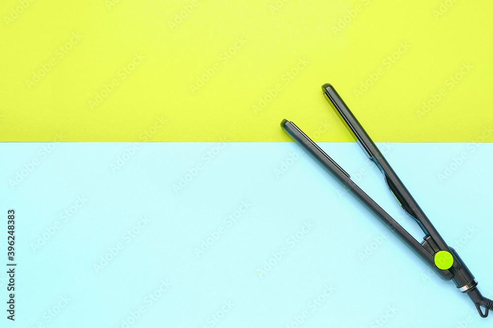 Straightening iron on color background Straightening iron on color background