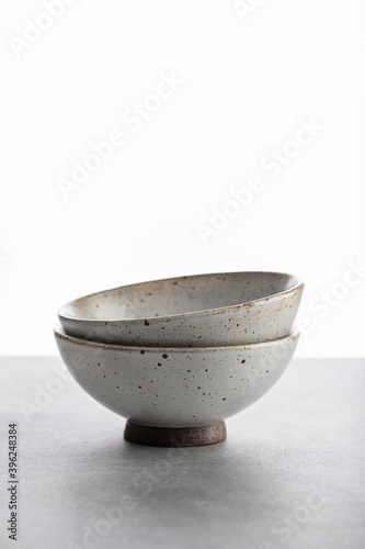 Tablou canvas handmade ceramics, empty craft ceramic bowls on light background