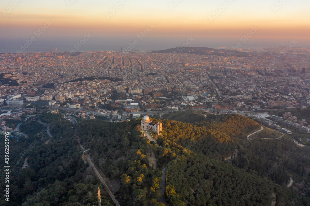Aerial drone shot of Tibidabo Mountain with city view of Barcelona