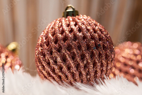 red christmas ball decorations  on white feathers