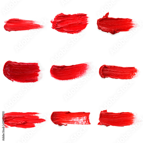 Lipstick smear smudge swatch isolated on white background. Cream makeup textu