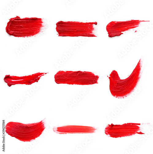 Lipstick smear smudge swatch isolated on white background. Cream makeup textu
