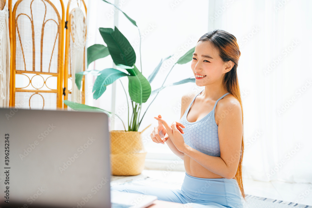 Beautiful sporty woman teaching yoga lesson online course. Beautiful sporty woman teaching yoga lesson online course.