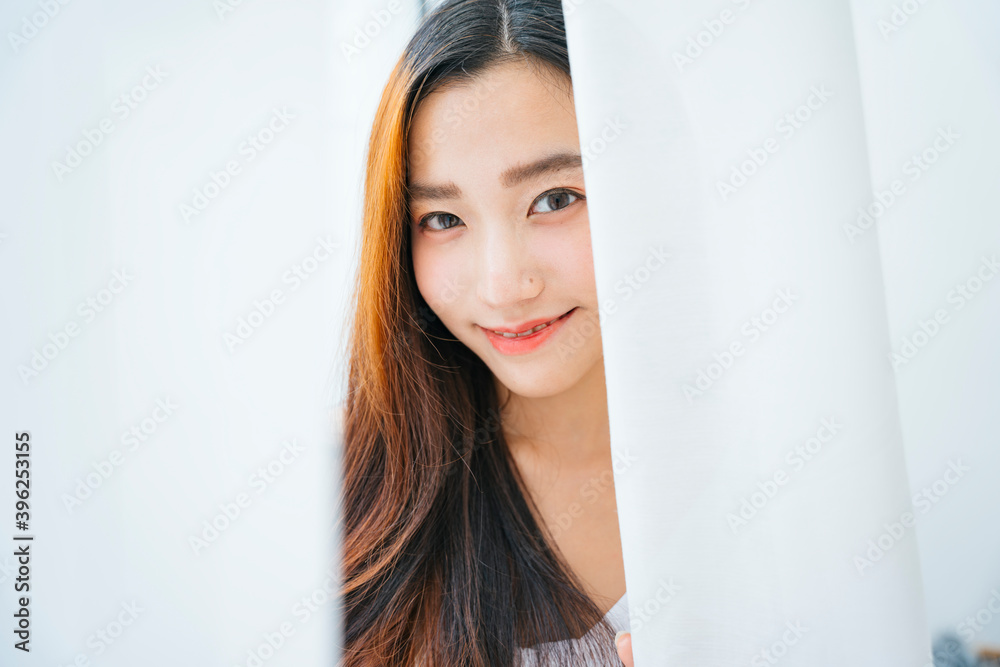 Close up portrait of beautiful asian woman behind white curtain. Close up portrait of beautiful asian woman behind white curtain.