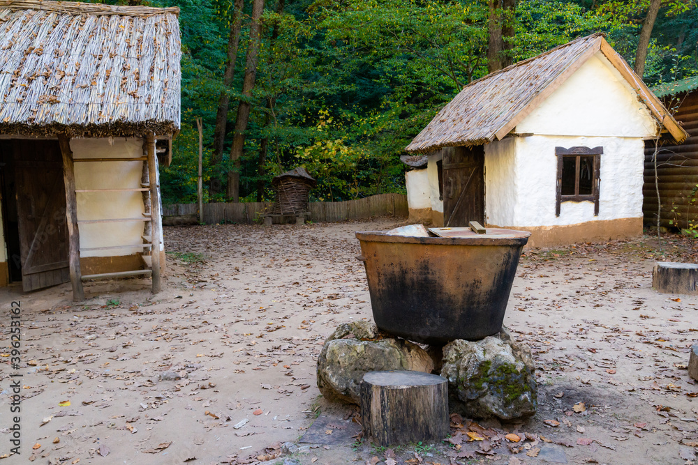 Traditional white slavic house with a thatched roof