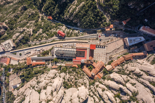 Aerial overhead drone view of Abbey of Montserrat near Barcelona in morning sunrise photo