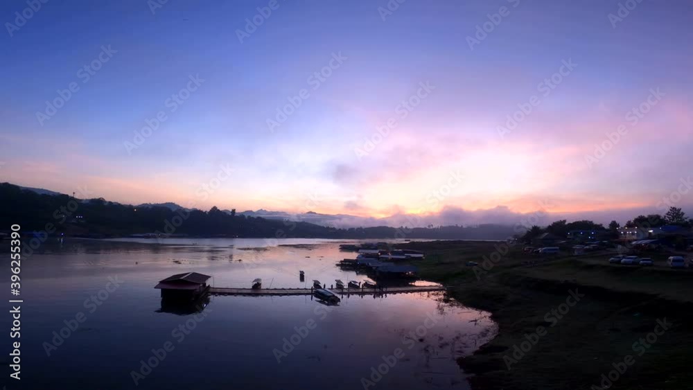 Pier at Mon Bridge, boats are sailing and people walking to enjoy the view of the sunrise in the morning. 4k Pier at Mon Bridge, boats are sailing and people walking to enjoy the view of the sunrise in the morning. 4k