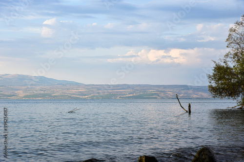 Blue cloudy sky over the Sea of Galilee and Golan Heights over the Sea of Galilee and Golan Heights. High quality photo.