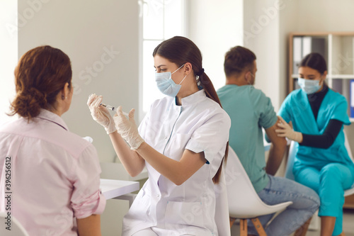 Photography Qualified nurses giving people Covid-19 or flu vaccines during mass vaccination