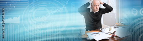 Overworked businessman sitting at a messy desk; panoramic banner