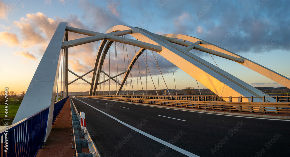 Modern construction highway bridge at sunset