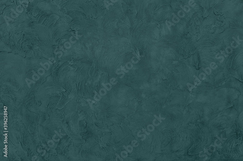 Trendy dark green colored low contrast concrete textured background with roughness and irregularities to your design or product 2021 color trend concept Urban modern design. Home decor. 