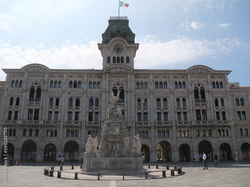 Fototapeta premium Town Hall building in Piazza Unità d'Italia in Trieste, exterior with eclectic style and the fountain of the Four Continents in front