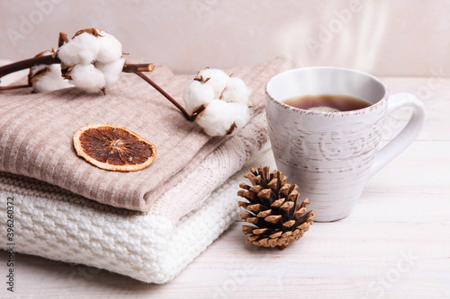 Warm winter sweaters and a cup of hot tea