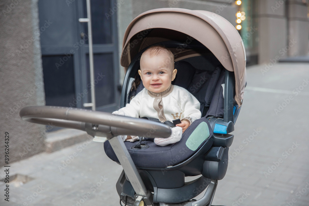 Cute little baby sitting in a stroller Cute little baby sitting in a stroller