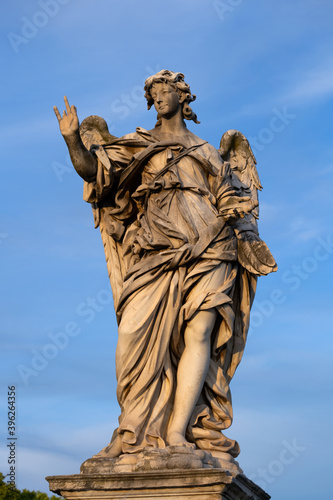 Angel with the Nails statue on Ponte Sant Angelo bridge in Rome  Italy. Marble sculpture from 17th century by Girolamo Lucenti