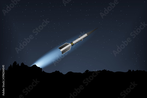 A nuclear missile flies in the night sky.