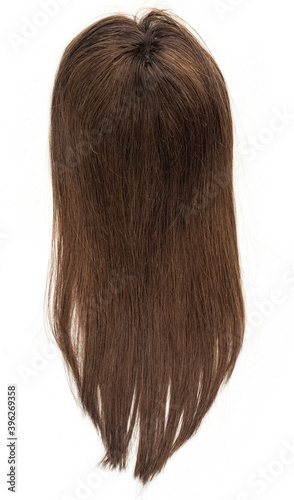 A long straight brunette wig, toupee or hair topper against a plain white backdrop. photo