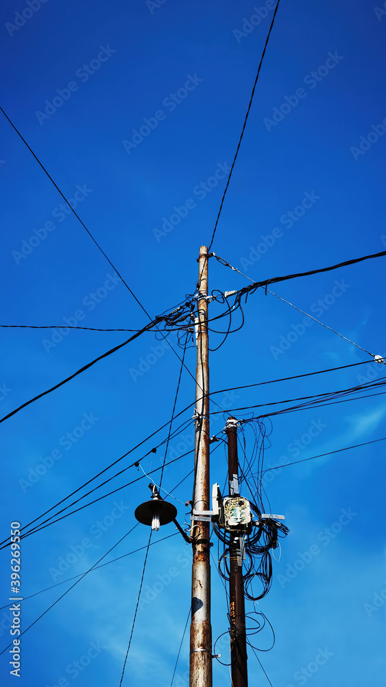 Electric pole with blue sky background Electric pole with blue sky background