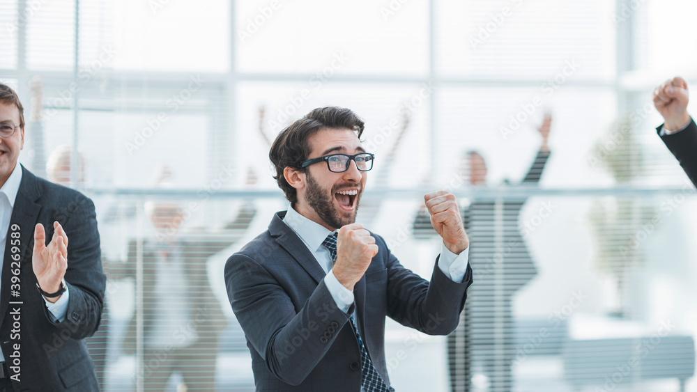 group of successful employees is celebrating in the office.