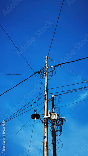 Electric pole with blue sky background