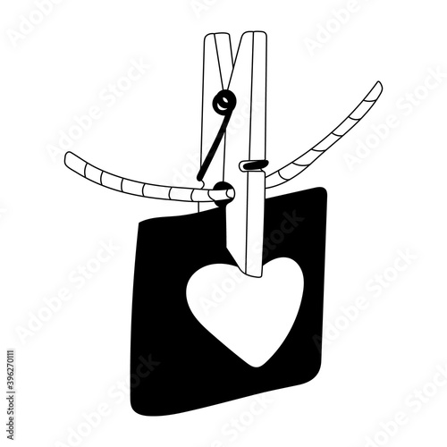 Love note decorated with heart with a clothespin on a rope. Valentine's day decoration. Vector doodle  illustration for posters and greeting cards design isolated on white. Black outline.